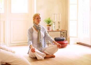 woman meditating in a meditation room