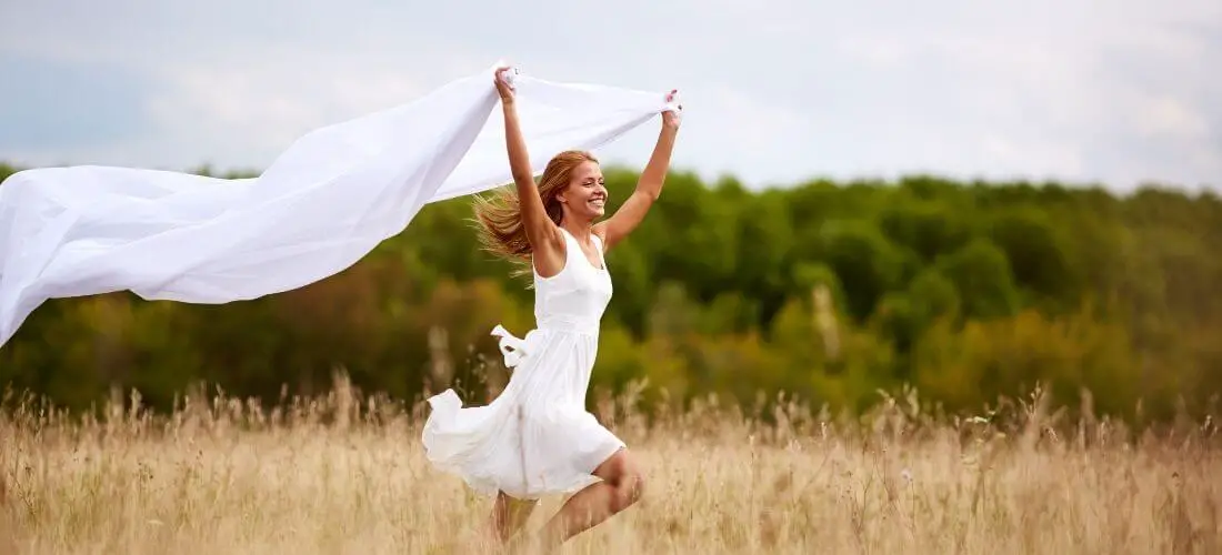 woman in white dress running
